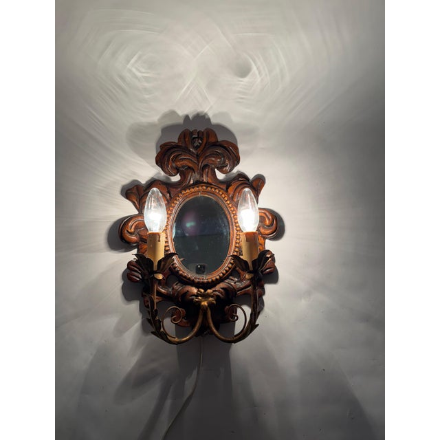 This stunning wall lamp, crafted in the elegant style of luxury baroque with a mirror, was lovingly made by a skilled...