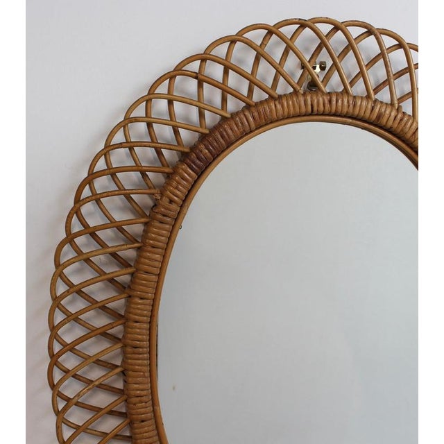 Rattan wall mirror (circa 1960s) in that inimitable italian style that is so loved. This mirror has a complex weave of...