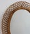 Rattan wall mirror (circa 1960s) in that inimitable italian style that is so loved. This mirror has a complex weave of...
