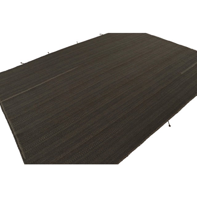 Handwoven in wool, a 9×13 Kilim in Brown with Beige accents, from a bold new line of contemporary flatweaves, ‘Rez Kilim’,...