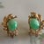 Elegant vintage earrings crafted in 14K yellow gold and set with beautiful oval green jade cabochons. The jade stones...