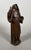 Saint Anne or Saint Bridget, carved wood with a brown patina French work, 17th century She is depicted with one hand...