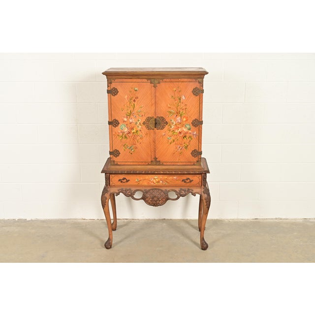 A gorgeous antique Georgian or Chippendale style bookcase, dining cabinet, or bar cabinet In the manner of Berkey & Gay...