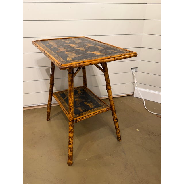 This 19th Century English Bamboo Side table features a delightful variety of equine images decoupaged onto the top and...