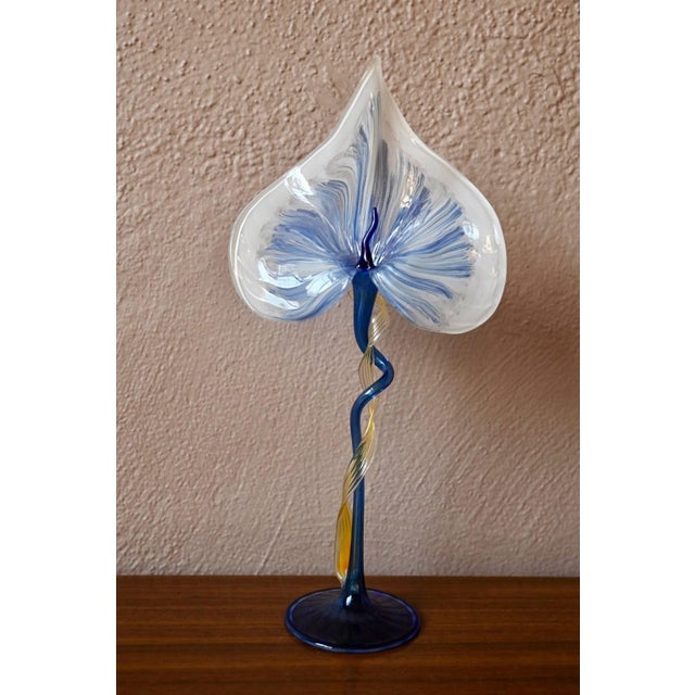 Handcrafted, colorful blown glass decoration from the 1980s, very fine and vibrant in blue, yellow, and white. Signed with...