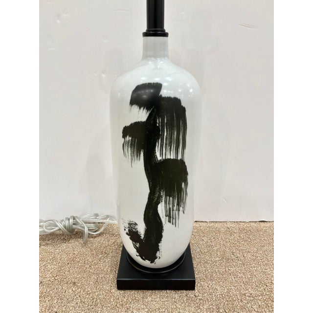 Stylish Currey & Co Modern Asian Inspired Black & White Porcelain Lamp. Black brushed botanical design, on square black base.