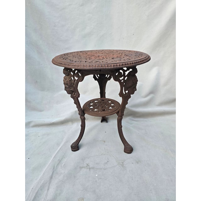 This is a pair of exquisite Victorian iron bistro tables. These are sometimes referred to as English pub tables or garden...