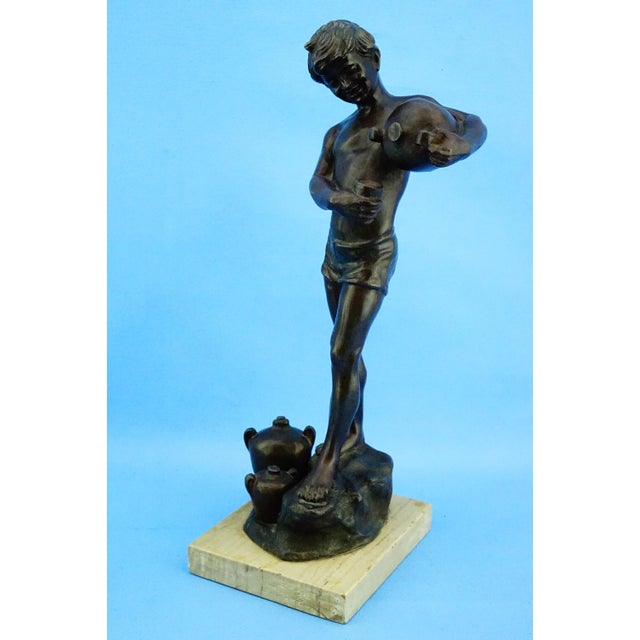 MEASUREMENTS: Height: 36.5 cm; Width: 15 cm; Depth: 14.5 cm; Weight: 2.393 kg Item : Periodical full-body sculpture of a...