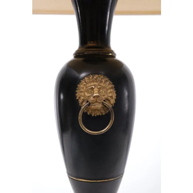 Very nice Black Metal table lamp. Beautiful cast Bronze lions head on a Marble base, complete with Silk shade. Former USA...