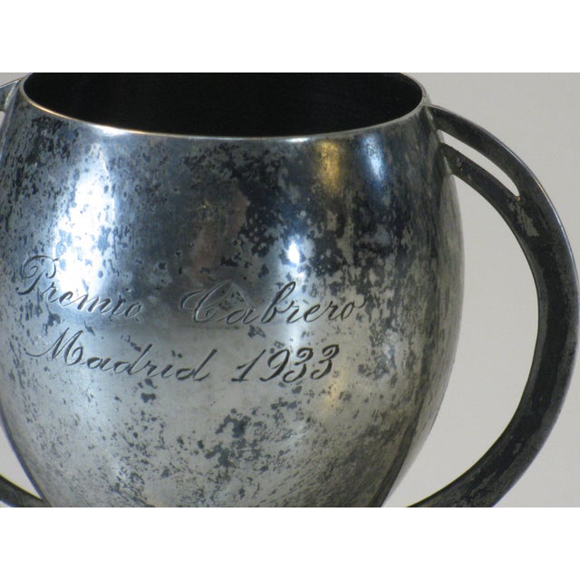 This vintage trophy cup is made of solid sterling silver in an Art Deco style. It originates from Madrid, Spain and is...