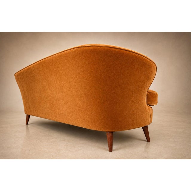 An exceptional example of Brazilian mid-century modern design, this rare Concha sofa by Joaquim Tenreiro embodies the...