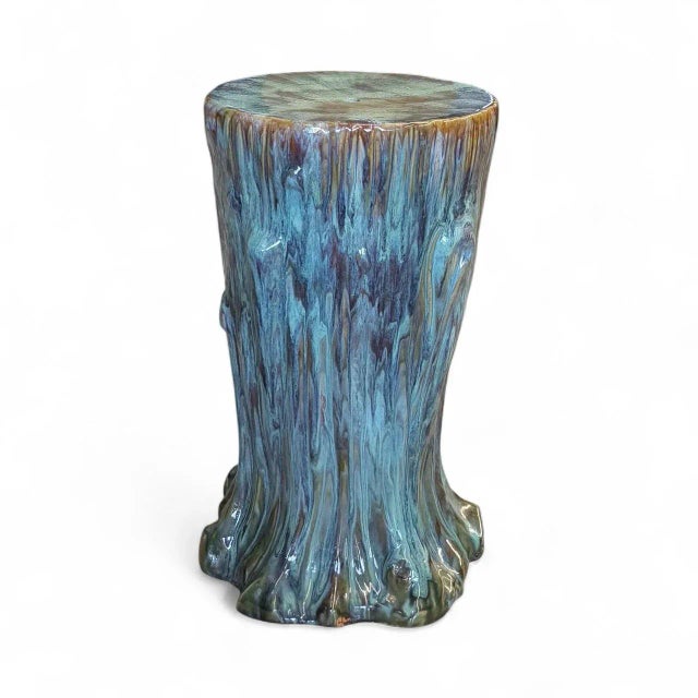 A majolica chair side table or garden stool in the form of a tree trunk glazed in shades of peacock blue and green and...