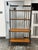 Design Plus Gallery presents an Industrial Iron + Wood Four-Tier Étagère. The tall open framework is constructed from...