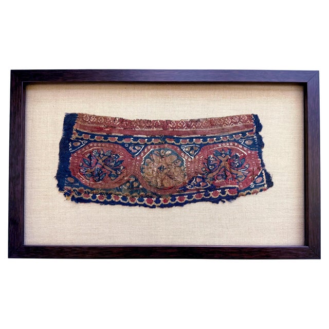 A small piece of antique Coptic textile woven as a horizontal band with two linear scallop borders flanking three central...