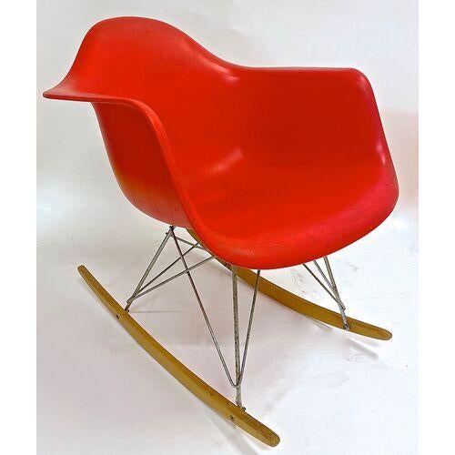 Vintage Mid-Century Modern style rocking chair with molded hard plastic arms and seat. Metal Eiffel Tower style leg...