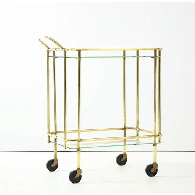 Stunning 1950's Mid-Century Modern solid brass two tier Italian bar cart, in vintage condition with some wear and patina...