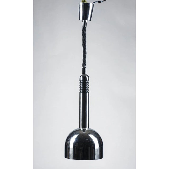 Steel and white glazed chandelier with sliding central part of the production of years 1970 measures diameter 22.5 x h 87...