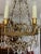 Exceptional 20th century Empire brass and crystal basket chandelier with 10 lights. The top has a waterfall of crystals...