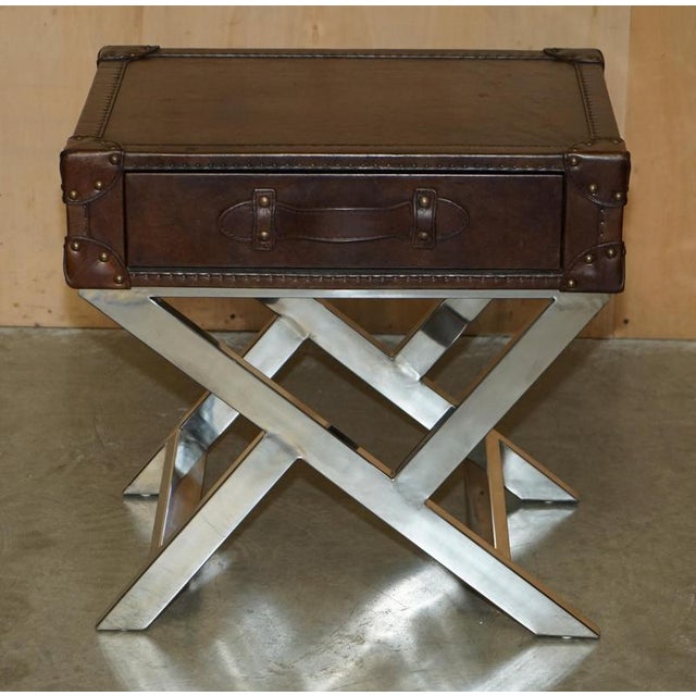 Super decorative luggage style Brown Leather single drawer side table with ornately polished chrome base. A very good...
