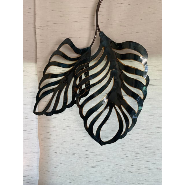 Bring a touch of exotic elegance to your home with this stunning tropical metal wall leaf. Crafted with intricate details,...