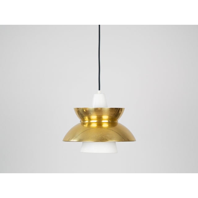 The Doo-Wop pendant lamp is a timeless design from the 1950s, created in collaboration with the Danish Navy. Initially...