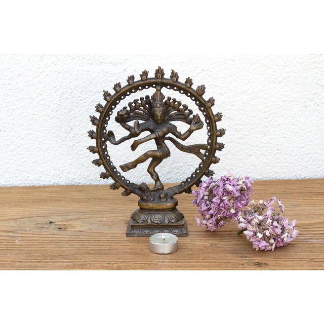 A compelling mid-scale devotional sculpture portraying the Lord of the Dance in his iconic cosmic circle of fire,...
