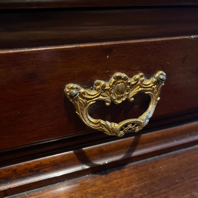A beautiful British Rococo Revival mahogany dressing table or Vanity with a large central beveled mirror with carved shell...
