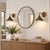 Add character to your walls with this handcrafted pair of brass cone wall sconces, featuring wide metal shades, curved...