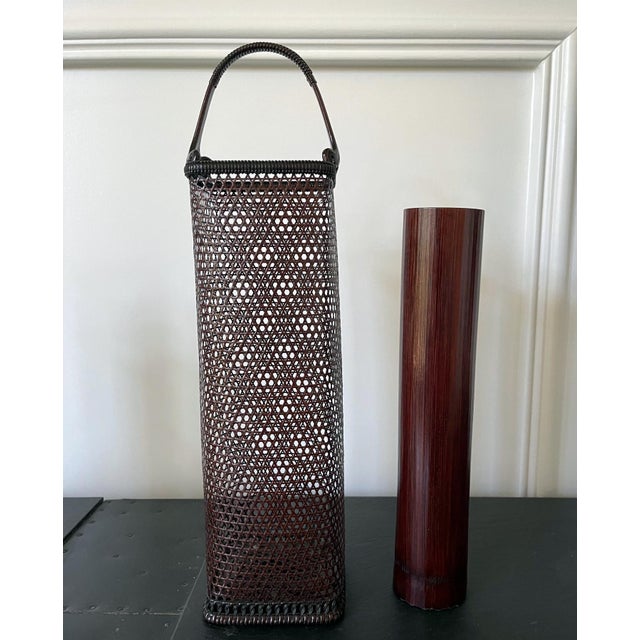 A woven bamboo flower Ikebana basket by Tanabe Chikuunsai II (1921-2000) from Showa era (1926-1989), circa 1950-1960s. The...