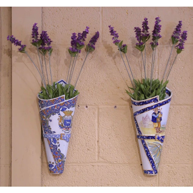 Bring color and Breton charm to a kitchen, hallway, or dining room with this striking pair of antique faience wall vases,...