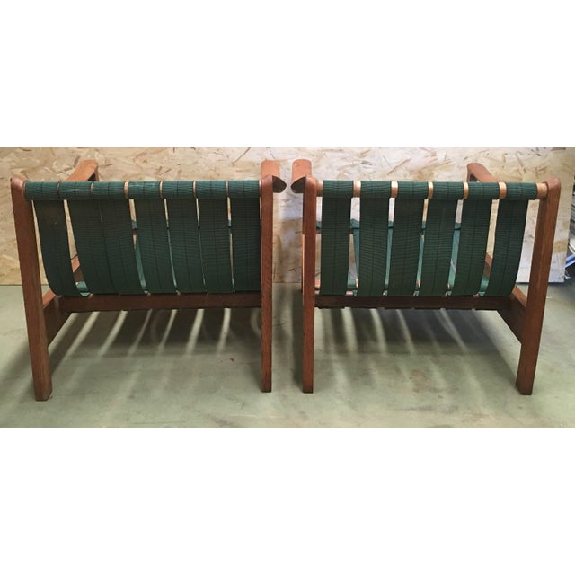 20th century vintage Danish teak armchairs with straps and cushions This is unique Danish armchairs features a sturdy teak...