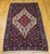 A masterful example of Persian textile artistry, this mid-20th century Senneh kilim area rug showcases the refined weaving...