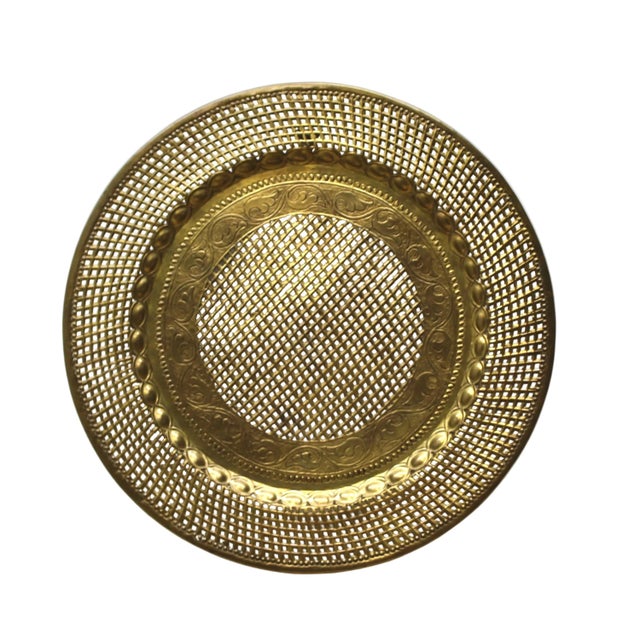 Brass platter or wall decor from the 1970s with a lattice weave open-work (riticulated) pattern design around the...