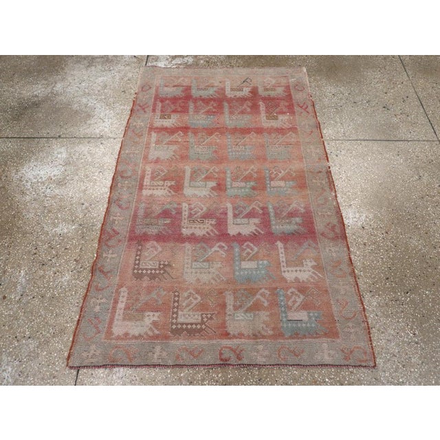 A vintage Turkish Anatolian throw rug handmade during the Mid-20th century. Measures: 3' 1" x 5' 1"