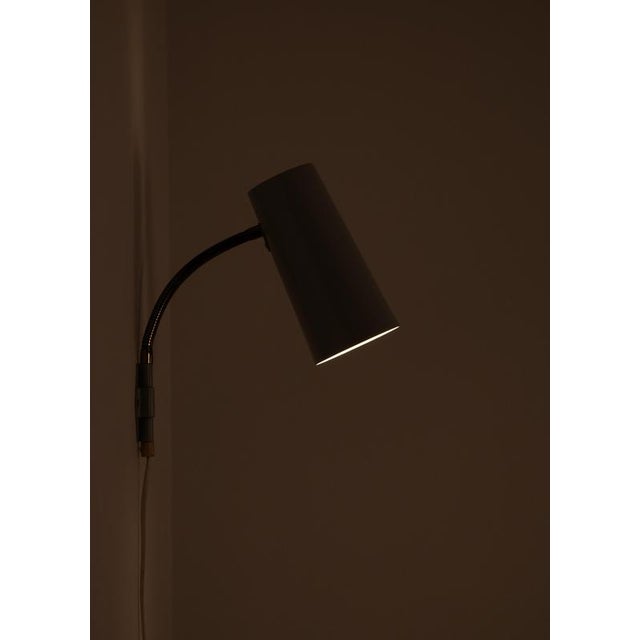 Wall lamps produced in Sweden during the 1950s by Böhlmarks. Grey painted metal and brass. 3 pieces available. Listed...