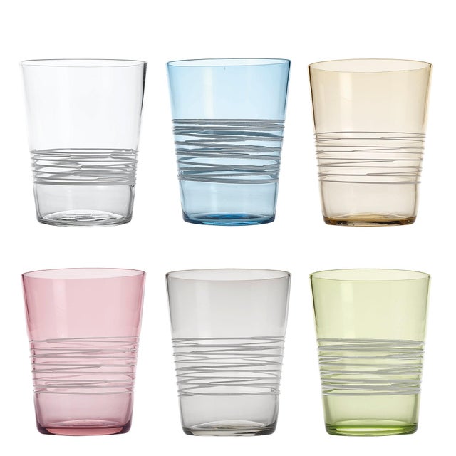 Handmade colored tumblers in mass-colored glass, blown in light shades with a spiral of "lattimo" glass threads applied...