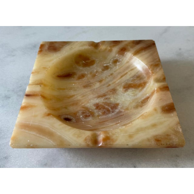 Large vintage mid century square yellow and orange alabaster ashtray with four button feet. Most likely made in Italy....
