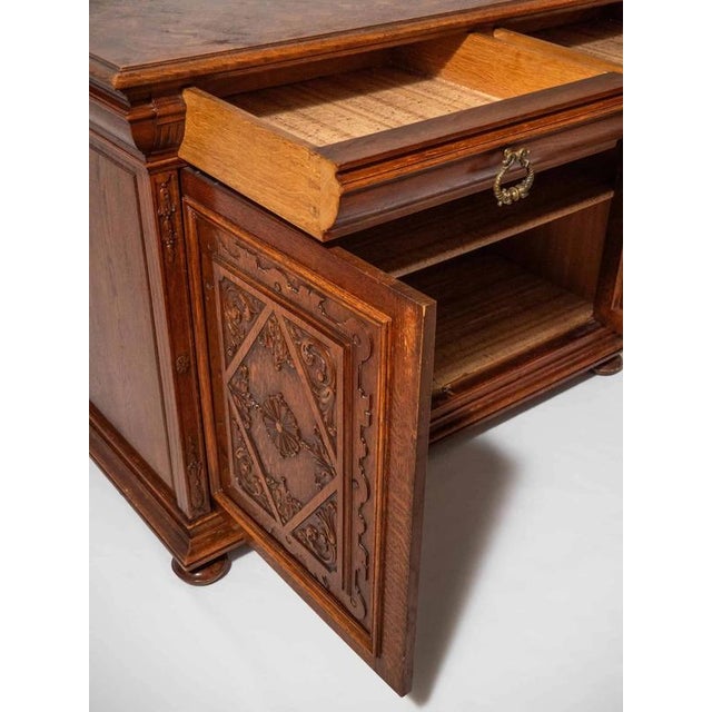 Hand-carved antique chest of drawers in the Renaissance style with a top made of parquetry, two top drawers with brass...