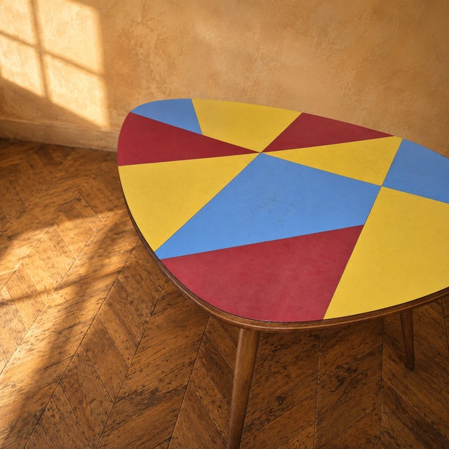 A compact Czechoslovak Brussels style coffee table with a distinctive combination of oak wood and colored umakart...
