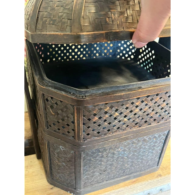 Believed to once have been used as a Linch Box, this decorative wicker basket has many layers inside and a unique carved...