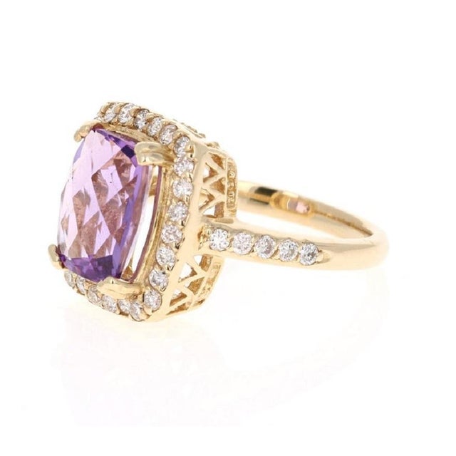 4.37 Carat Natural Amethyst Natural Diamond Yellow Gold Cocktail Ring This beautiful ring has a 3.70 Carat Cushion Cut...