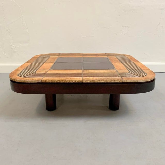 Beautiful roger capron signed mambo model coffee table, circa 1970, france. 4 cylindrical brown oak feet, brown plywood...