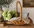 This beautiful oversized gathering basket has a warm honey-toned patina and sculptural woven handle that gives it...