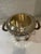 Antique Sheffield silverplate wine or champagne bucket. The bucket is heavy and is embossed with elaborate decorations of...