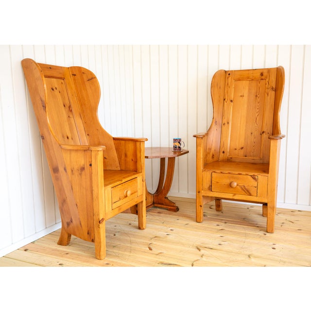 A delightful and rare pair of strikingly attractive blonde lambing chairs in lovely vintage condition. Made in rural...