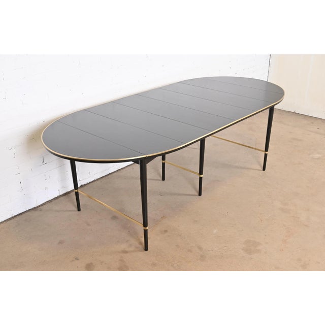 A rare and exceptional Mid-Century Modern extension drop leaf dining table By Paul McCobb for H. Sacks & Sons,...