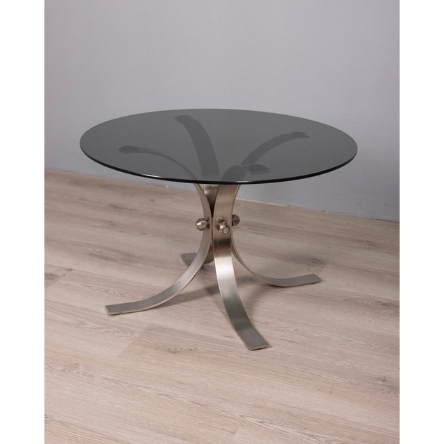 Coffee table with chromed metal frame and round smoked glass top, Italian design, 1960s.