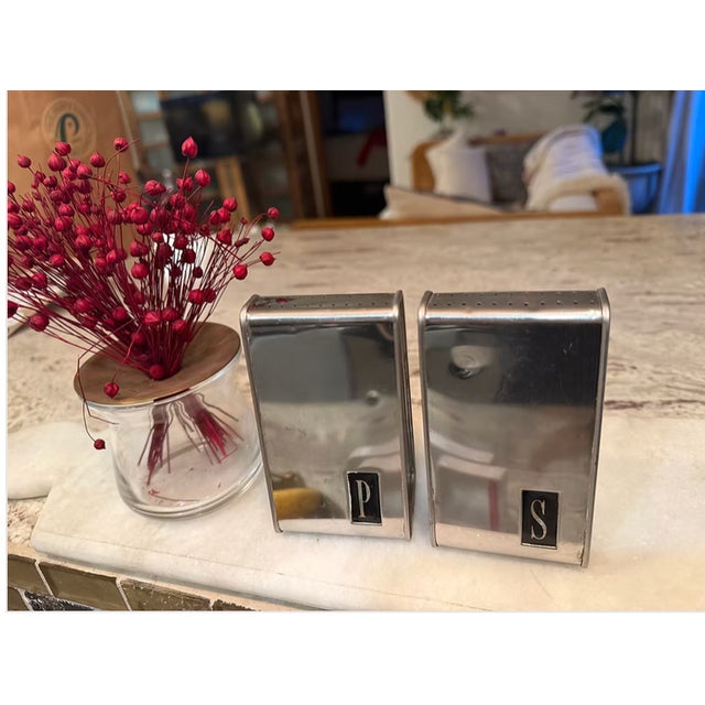 These MCM Lincoln Beauty Ware salt and pepper shakers showcase sleek mid-century lines and polished metal accents. Their...