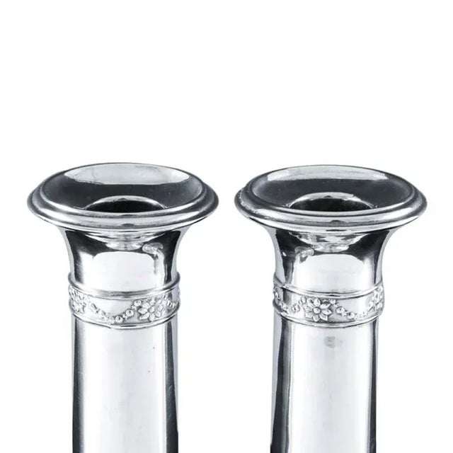 Enhance your collection with this exquisite pair of Antique English Edwardian Sterling Silver Candlesticks. Notice the...