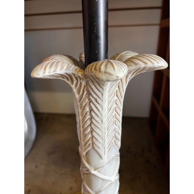 Bring a touch of coastal elegance and retro flair to your space with this stunning 1980s Hollywood Regency ceramic palm...